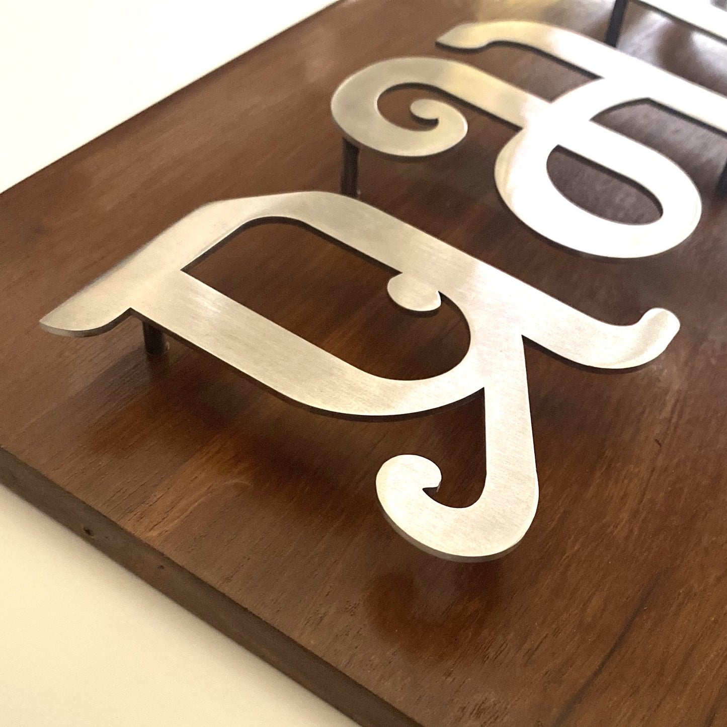 Teak wood With Steel Letters