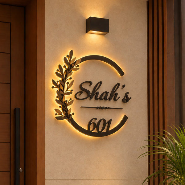 Elegant Botanical Design LED name plate in black powder-coated mild steel with rustic gold leaves