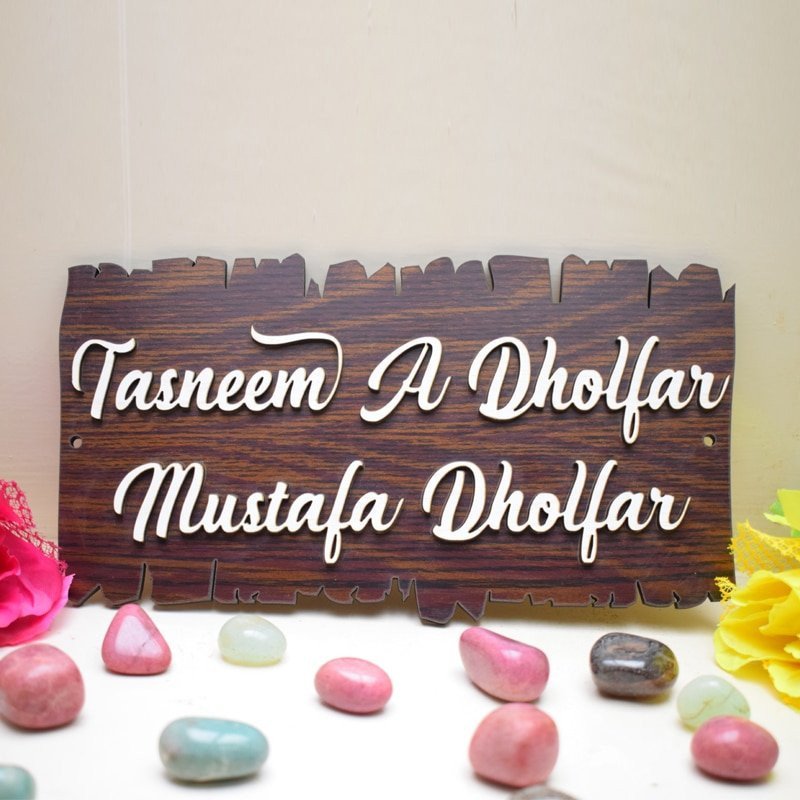 Rustic wooden plank name plate with laser-cut raised lettering for home