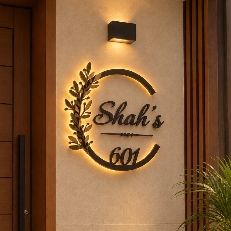Elegant Botanical Design LED name plate in black powder-coated mild steel with rustic gold leaves