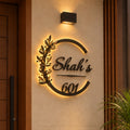 Elegant Botanical Design LED name plate in black powder-coated mild steel with rustic gold leaves