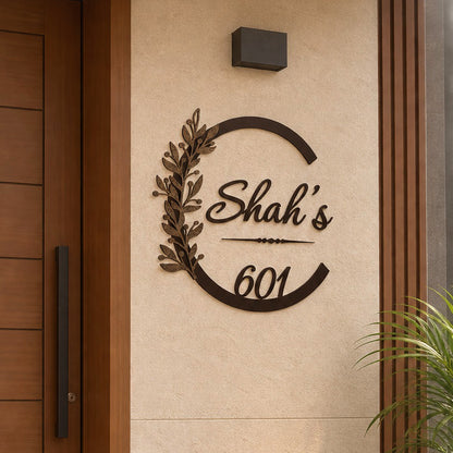 Elegant Botanical Design LED name plate in black powder-coated mild steel with rustic gold leaves