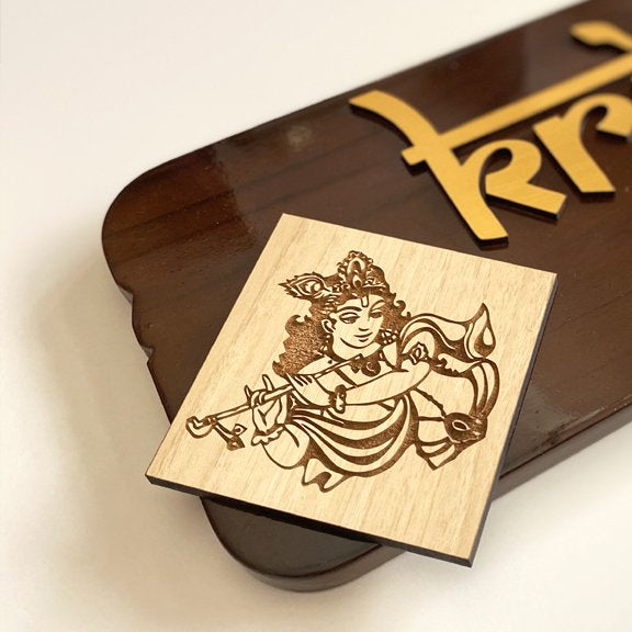 Close-up of raised 3mm letters on brown teak wood name plate with glossy polish