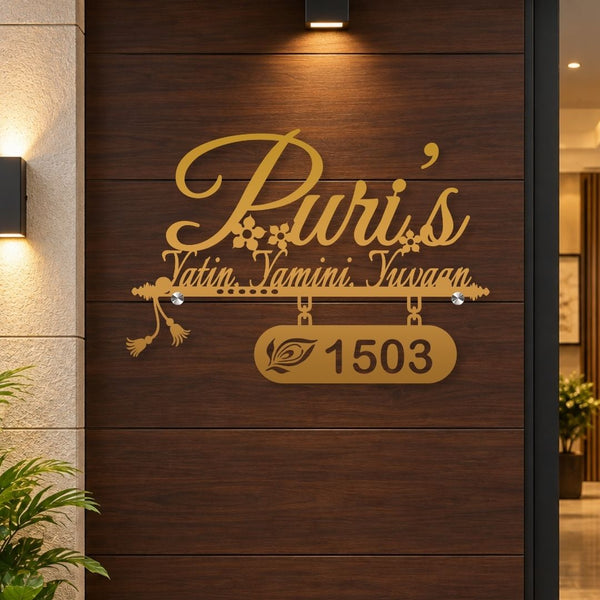 Gold personalized wall art featuring the text 'Puri's Yatin Yamini Iswaan' and the number '1503' mounted on a dark wood-paneled door