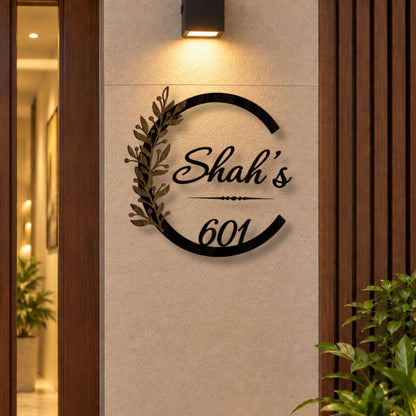 Elegant Botanical Design LED name plate in black powder-coated mild steel with rustic gold leaves