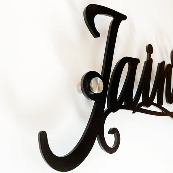 Close-up of matte black finish on 4mm mild steel name plate