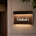 LED metal name plate glowing at night, illuminated name plate for home