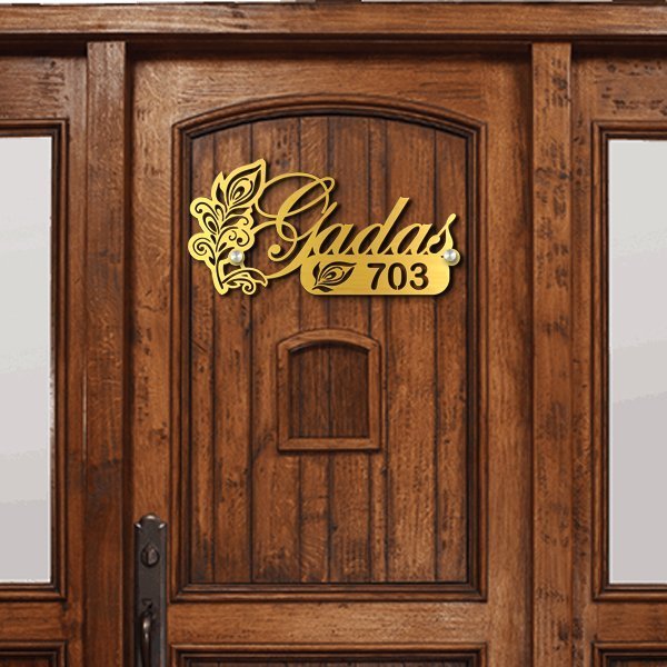 Close-up of gold finish and laser-cut lettering on Morpankh mild steel name plate