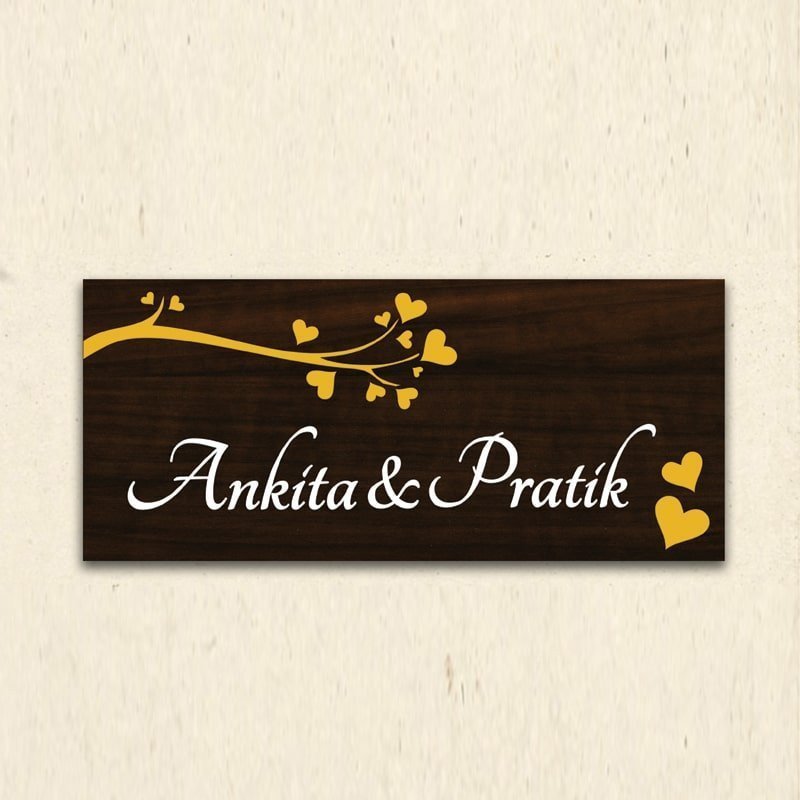 Personalized wooden couple name plate with raised names at a home entrance