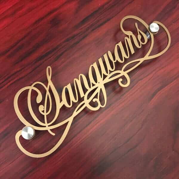 Close-up of clean black finish on slim mild steel name plate
